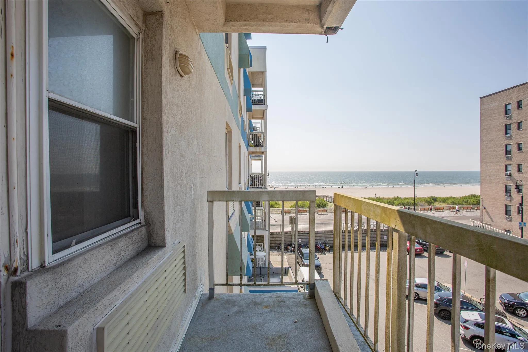 Balcony with view of water and beach Balcony with view of water and beach