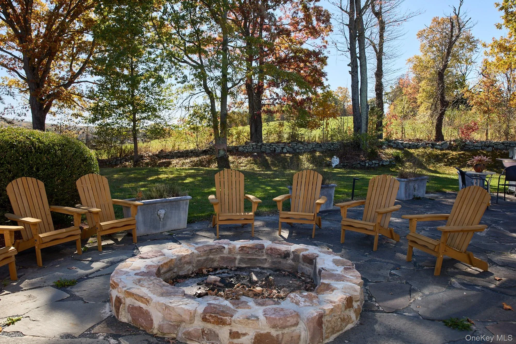 View of patio / terrace with a fire pit View of patio / terrace with a fire pit