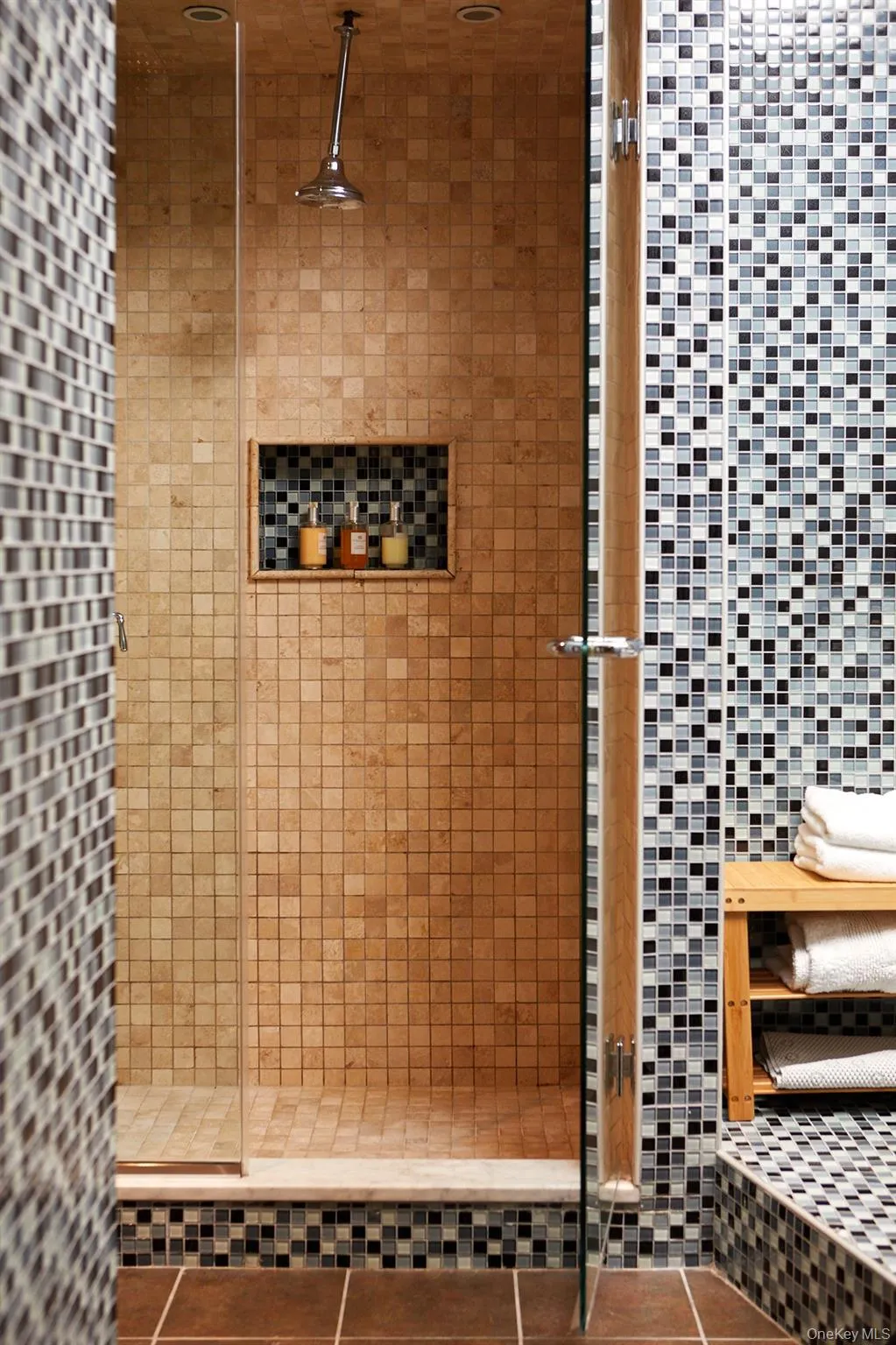 Bathroom with a stall shower and tile patterned floors Bathroom with a stall shower and tile patterned floors