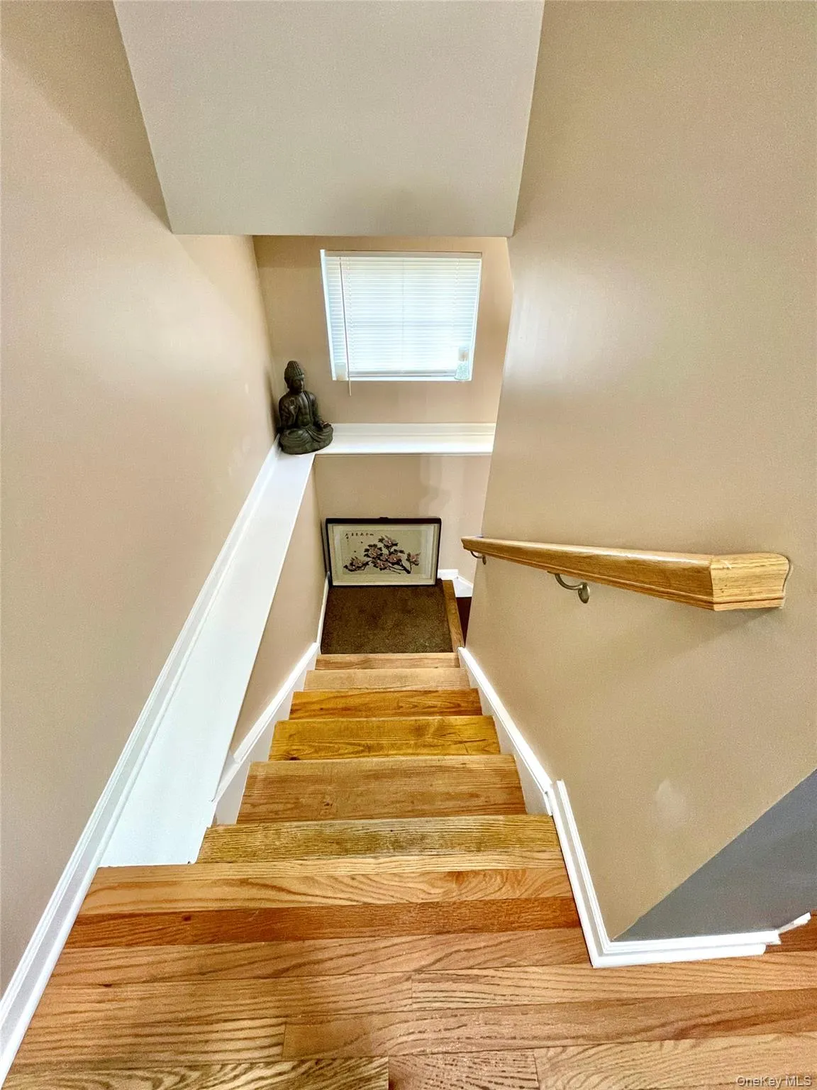 Stairway with wood finished floors and baseboards Stairway with wood finished floors and baseboards