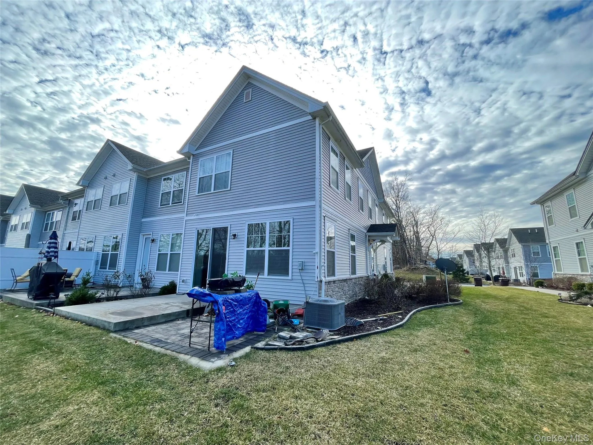 Back of house featuring a patio area, a yard, and a residential view Back of house featuring a patio area, a yard, and a residential view