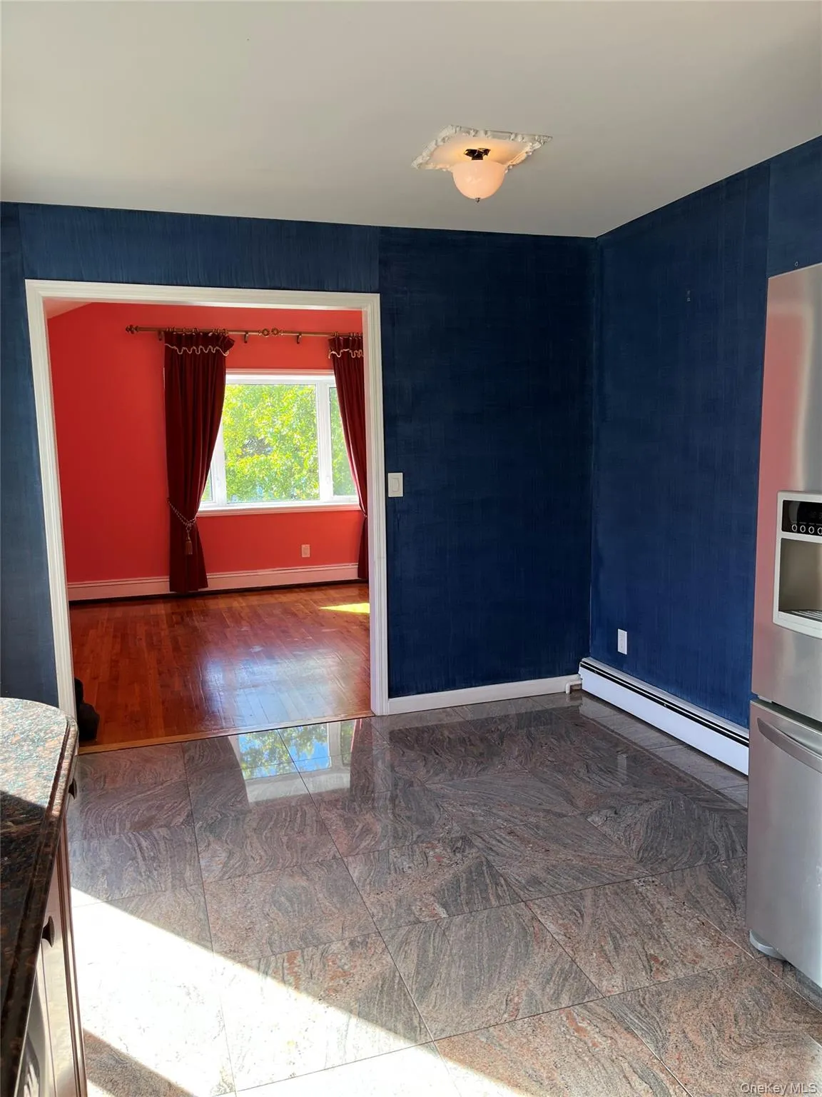 Unfurnished room featuring baseboard heating Unfurnished room featuring baseboard heating