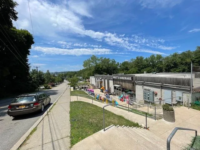 View of asphalt street with sidewalks View of asphalt street with sidewalks