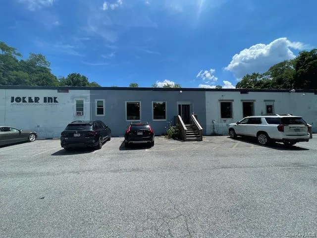 View of front of property with uncovered parking View of front of property with uncovered parking