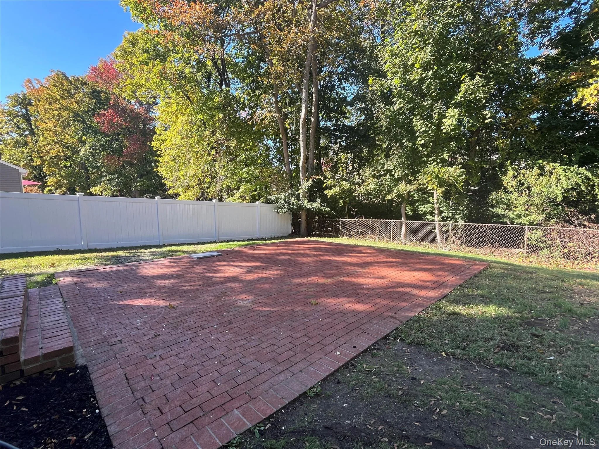Fenced backyard with a patio Fenced backyard with a patio