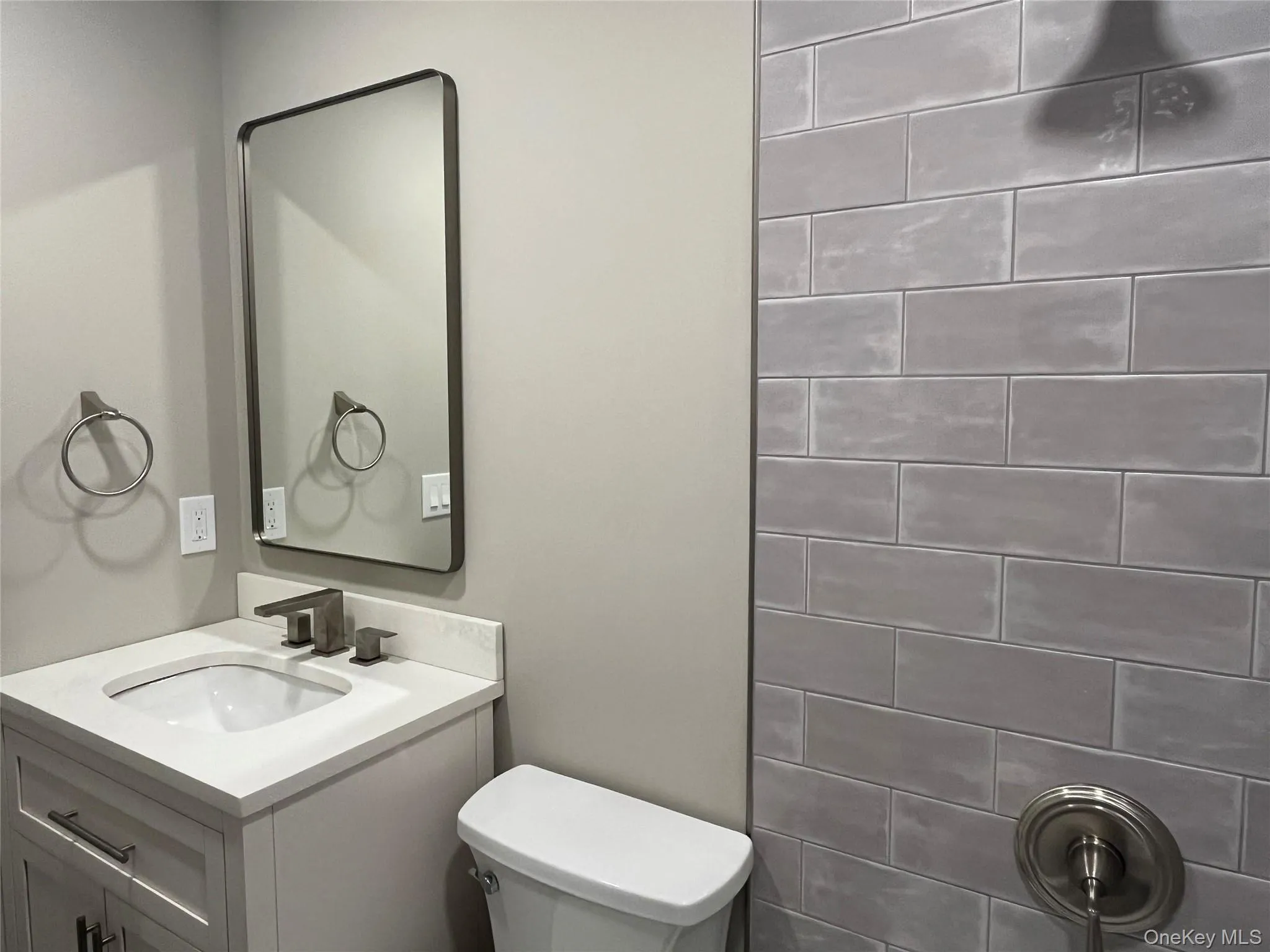 Bathroom featuring toilet and vanity Bathroom featuring toilet and vanity