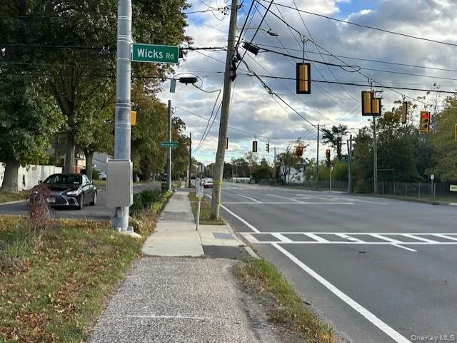 View of asphalt road with sidewalks View of asphalt road with sidewalks
