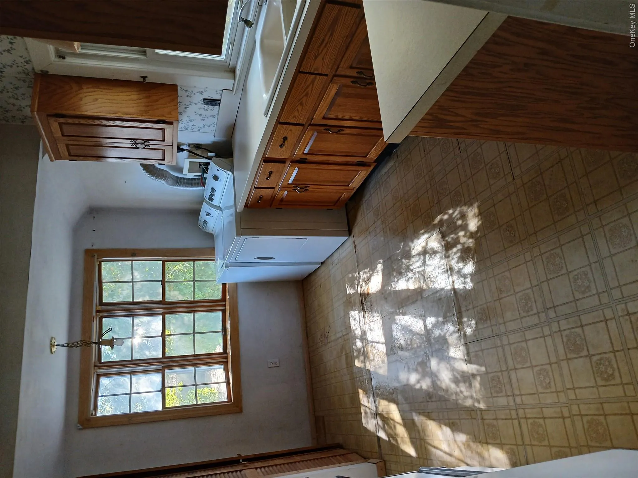 Laundry room featuring cabinet space and independent washer and dryer Laundry room featuring cabinet space and independent washer and dryer