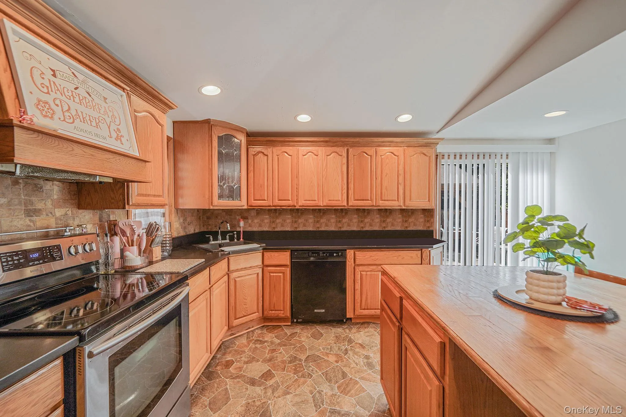 EIK with Ample Cabinetry/Countertop, Large Center Island with Storage and Room for Multiple Stools, SS Fridge/Stove, Dishwasher and Microwave EIK with Ample Cabinetry/Countertop, Large Center Island with Storage and Room for Multiple Stools, SS Fridge/Stove, Dishwasher and Microwave