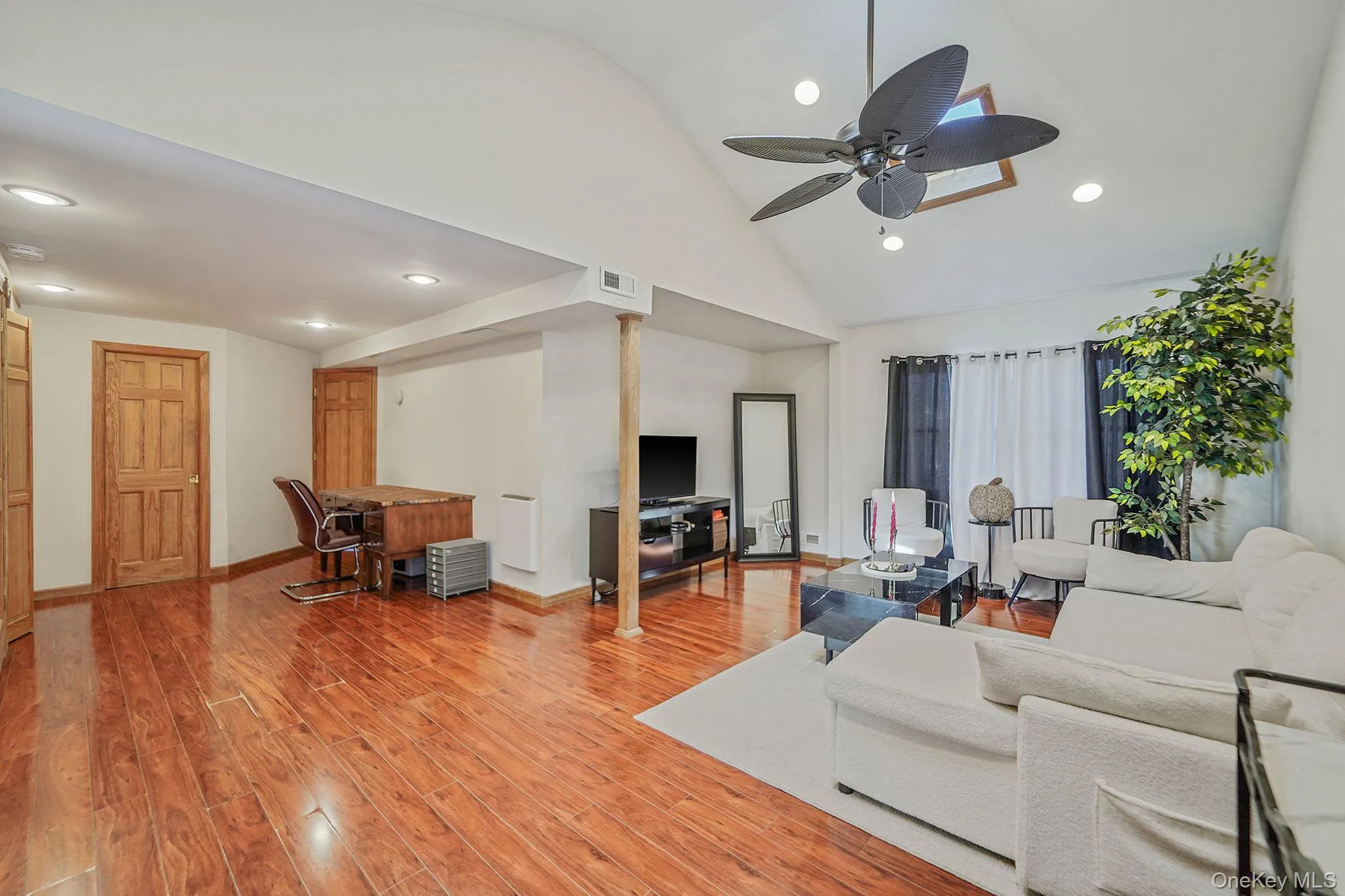 Living Room with Vaulted Ceilings, 2 Skylights, Recessed Lighting, Open Flow to Office Space/Dining Area Living Room with Vaulted Ceilings, 2 Skylights, Recessed Lighting, Open Flow to Office Space/Dining Area