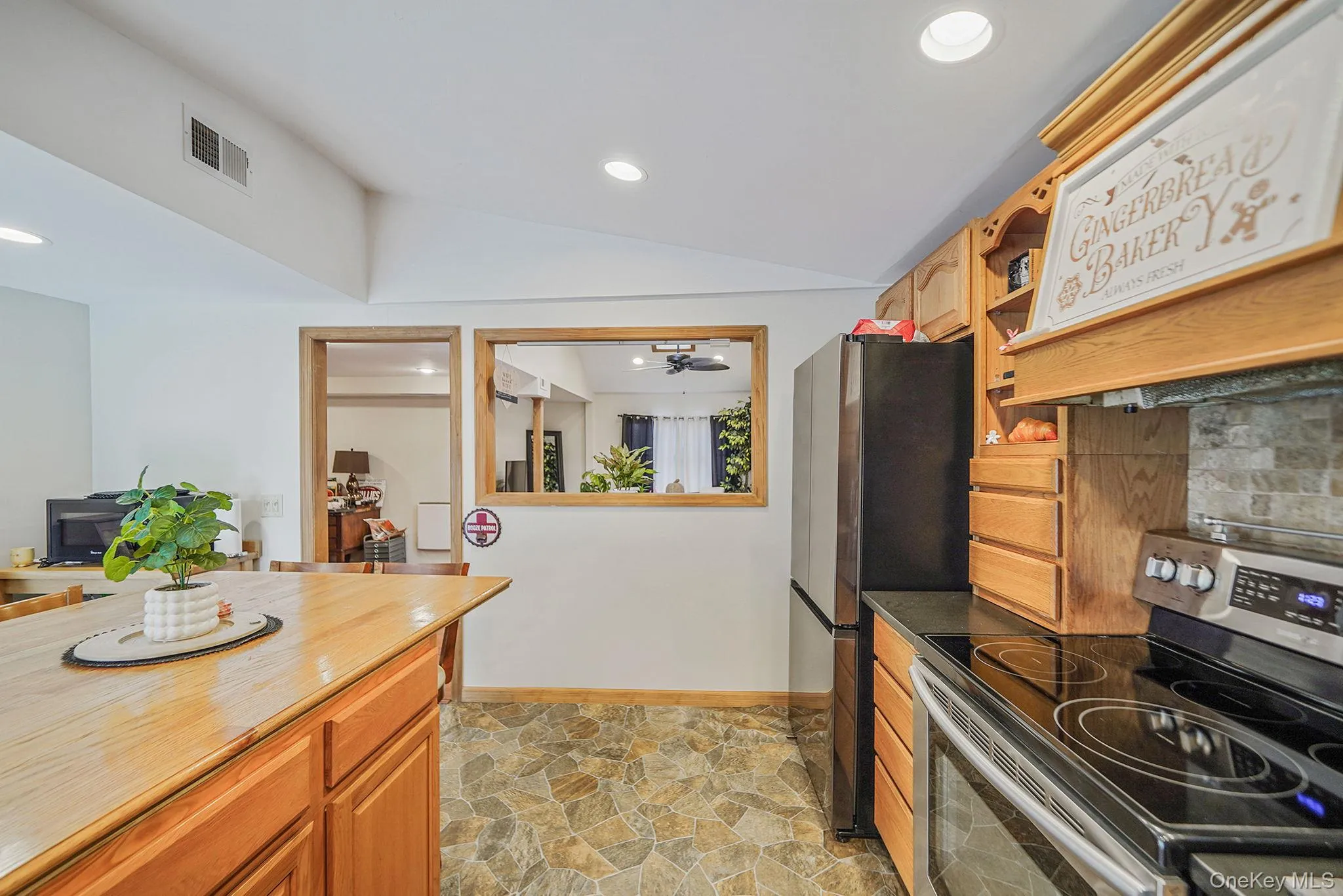 EIK with Ample Cabinetry/Countertop, Large Center Island with Storage and Room for Multiple Stools, SS Fridge/Stove, Dishwasher and Microwave EIK with Ample Cabinetry/Countertop, Large Center Island with Storage and Room for Multiple Stools, SS Fridge/Stove, Dishwasher and Microwave