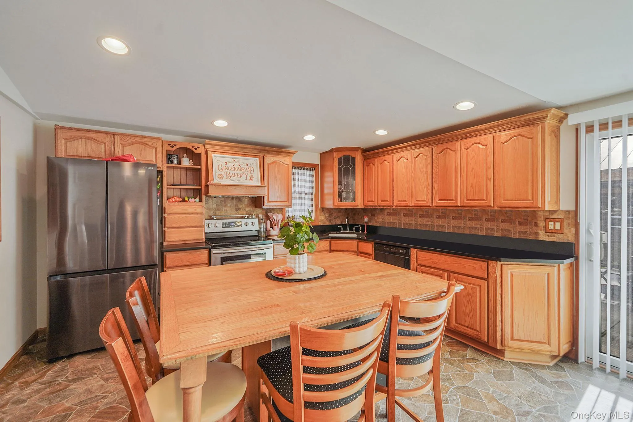 EIK with Ample Cabinetry/Countertop, Large Center Island with Storage and Room for Multiple Stools, SS Fridge/Stove, Dishwasher and Microwave EIK with Ample Cabinetry/Countertop, Large Center Island with Storage and Room for Multiple Stools, SS Fridge/Stove, Dishwasher and Microwave