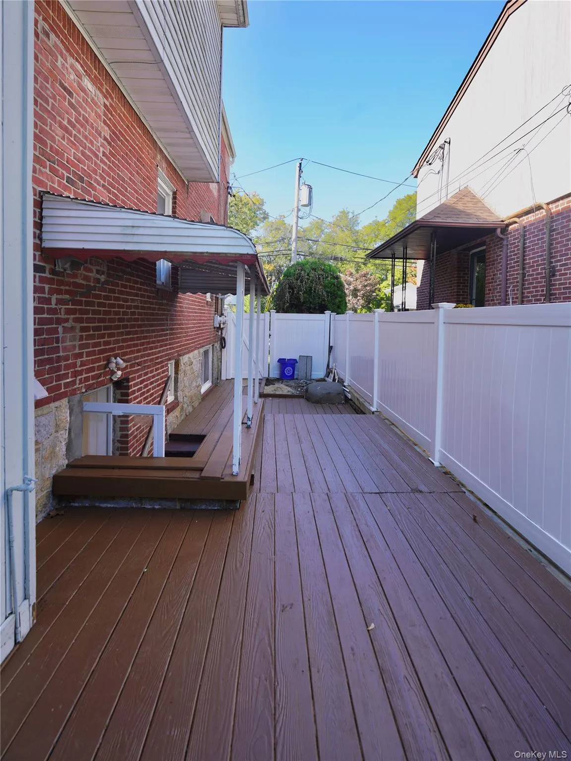 Wooden deck featuring a fenced backyard Wooden deck featuring a fenced backyard