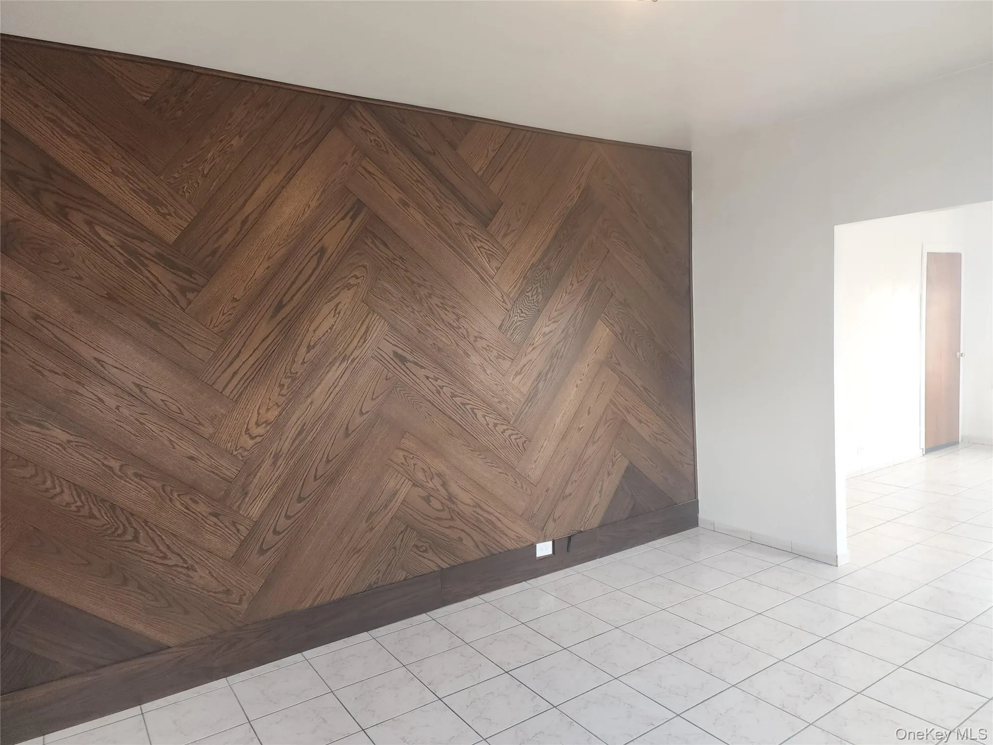 Spare room featuring light tile patterned floors Spare room featuring light tile patterned floors