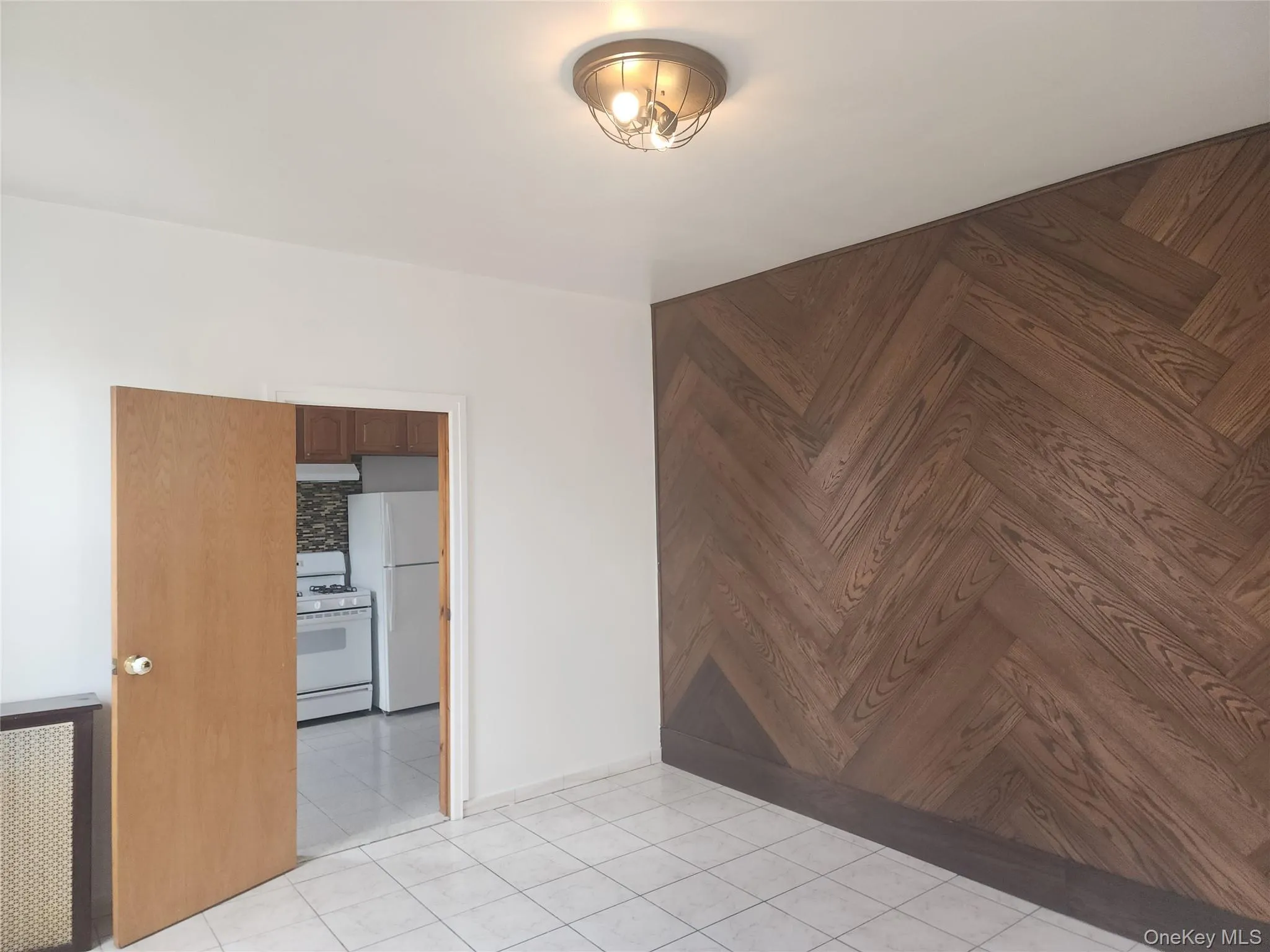 Unfurnished room with light tile patterned flooring Unfurnished room with light tile patterned flooring