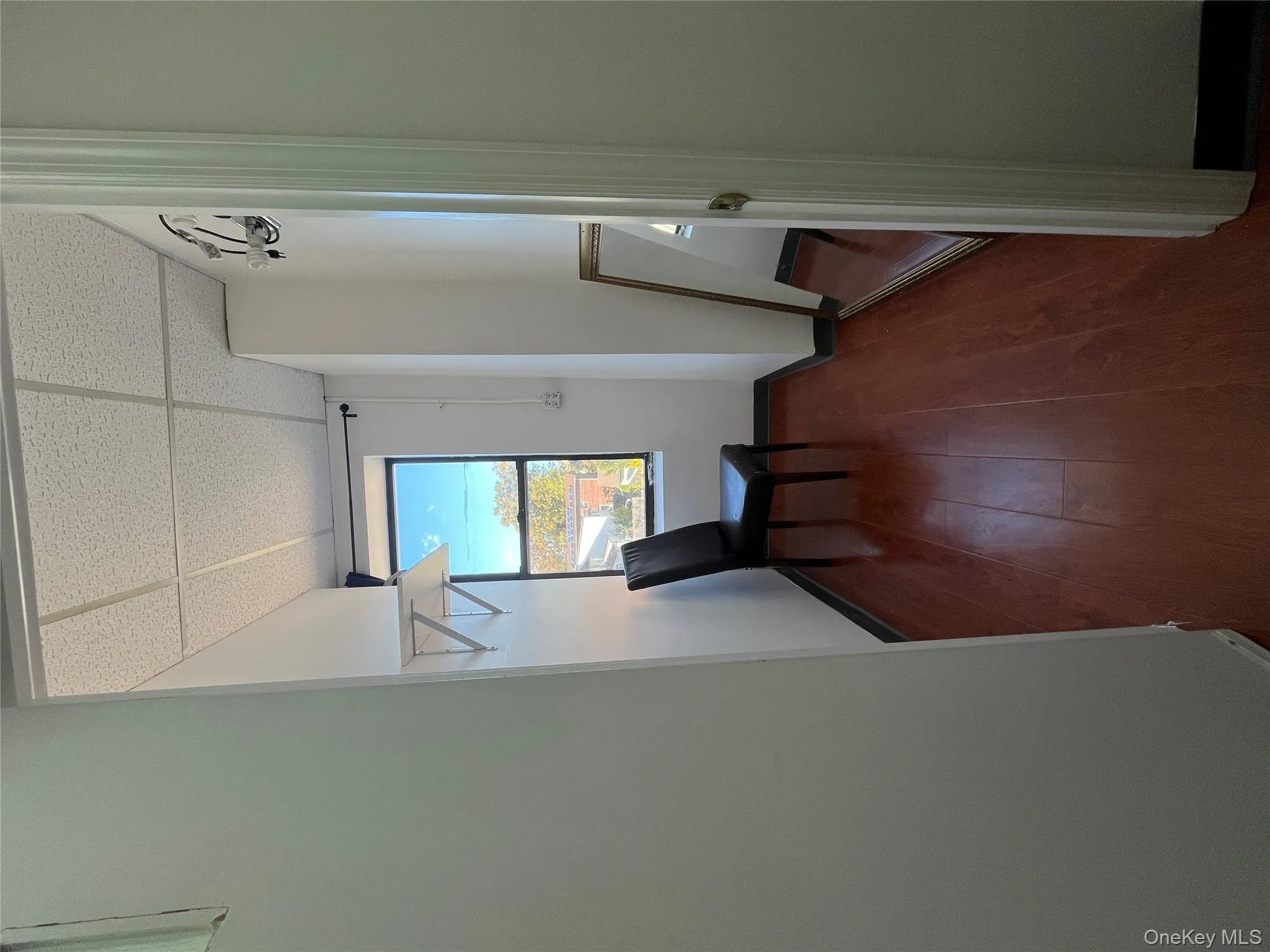 Corridor with a paneled ceiling and dark wood-type flooring Corridor with a paneled ceiling and dark wood-type flooring