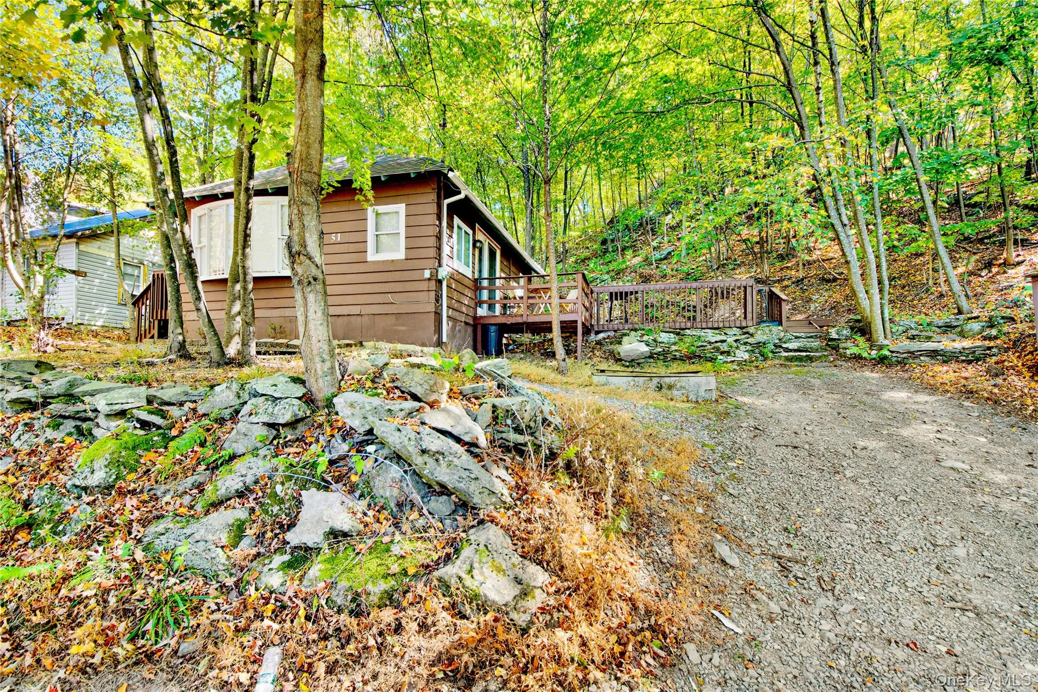 View of side of home featuring a deck View of side of home featuring a deck