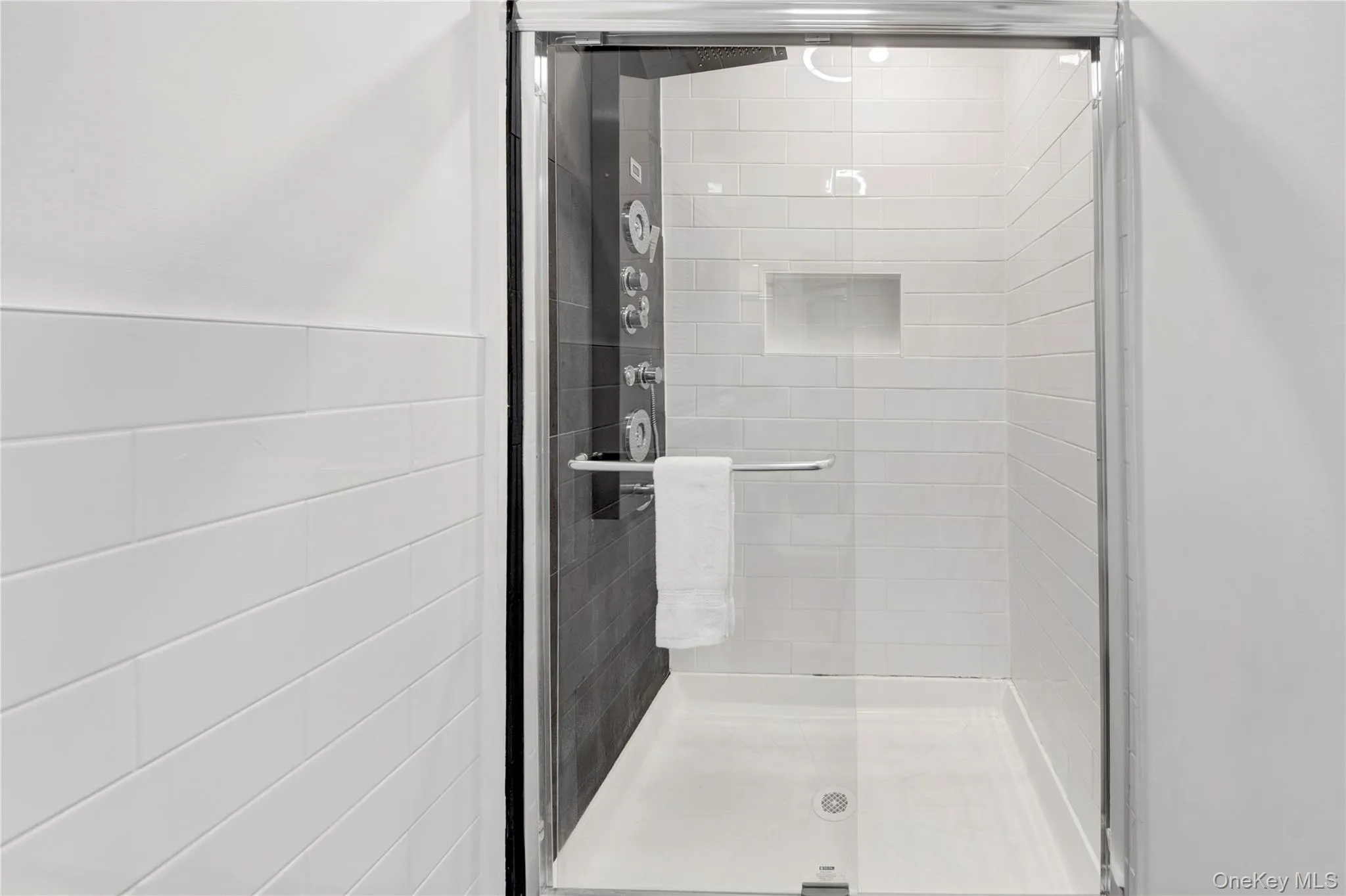 Full bathroom featuring a stall shower Full bathroom featuring a stall shower