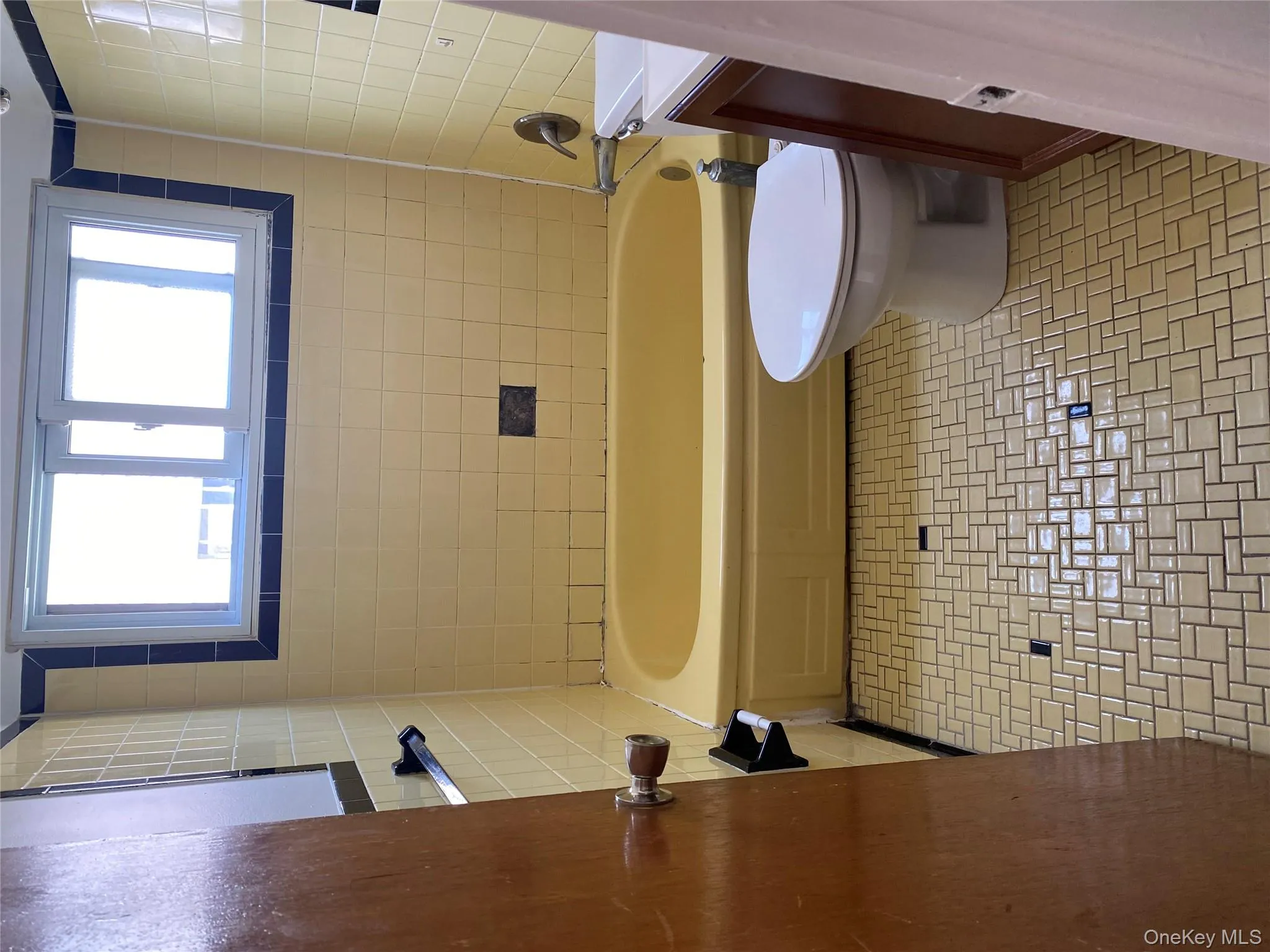 Bathroom with  shower combination, vanity, and light tile patterned floors Bathroom with  shower combination, vanity, and light tile patterned floors