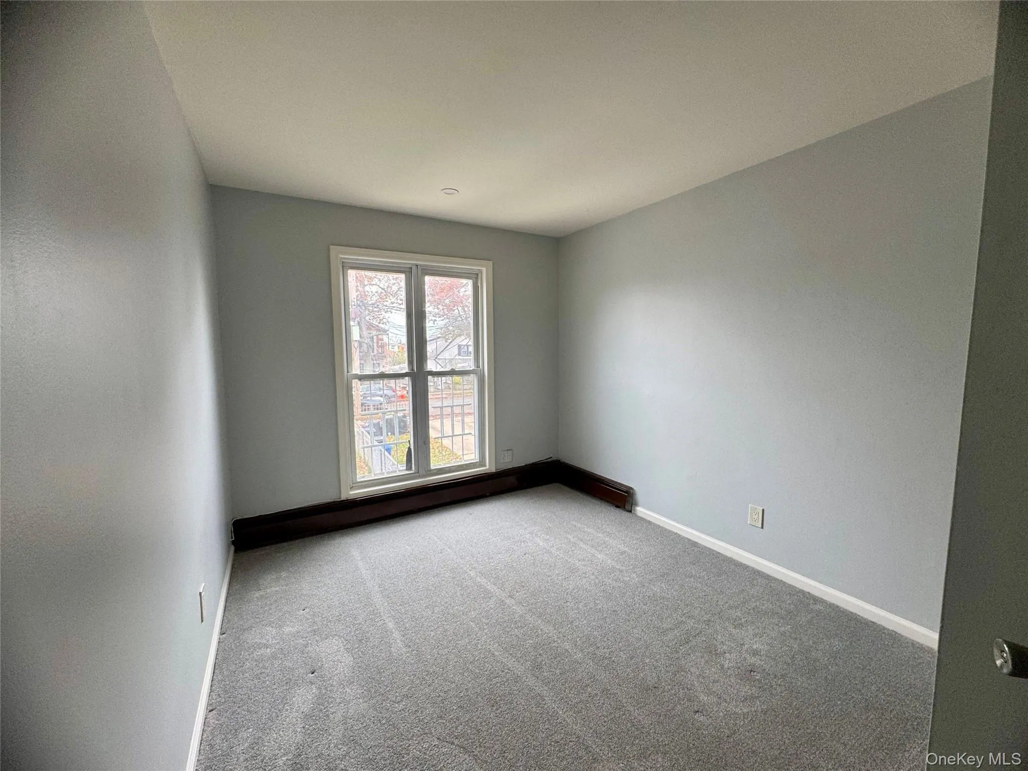 Carpeted third bedroom featuring baseboards Carpeted third bedroom featuring baseboards