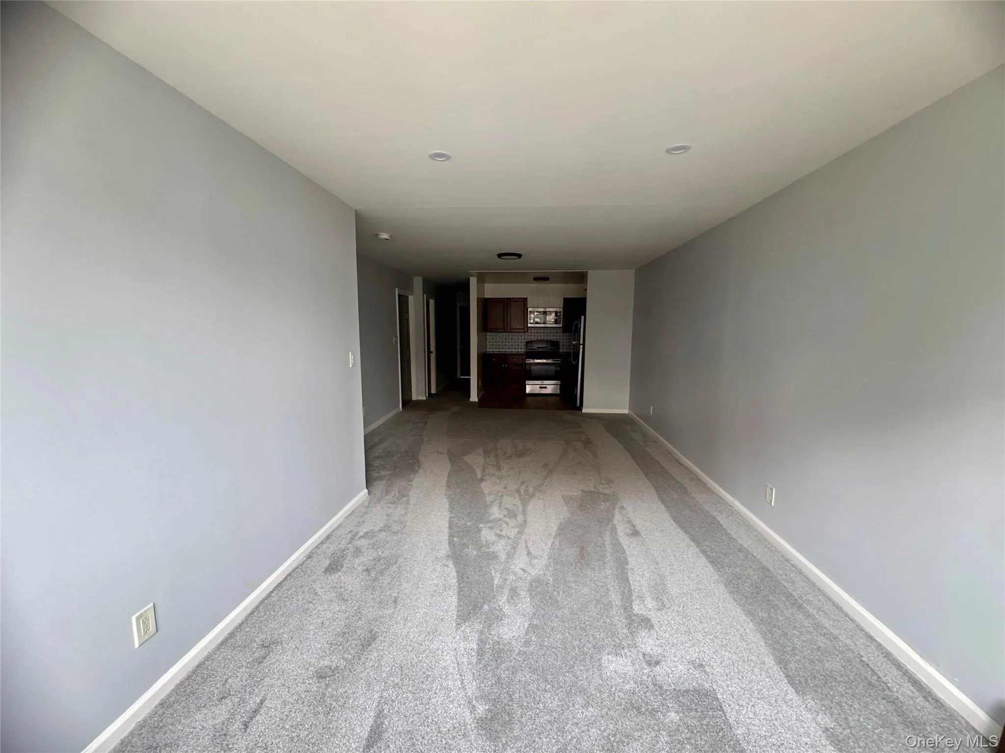 Spacious living room and dining room with large windows. Spacious living room and dining room with large windows.