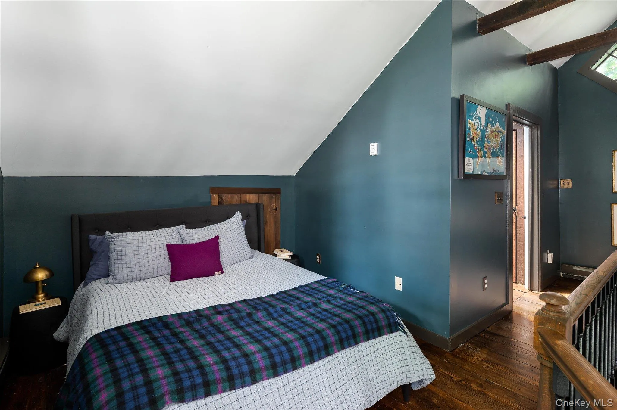 Bedroom featuring dark wood finished floors Bedroom featuring dark wood finished floors