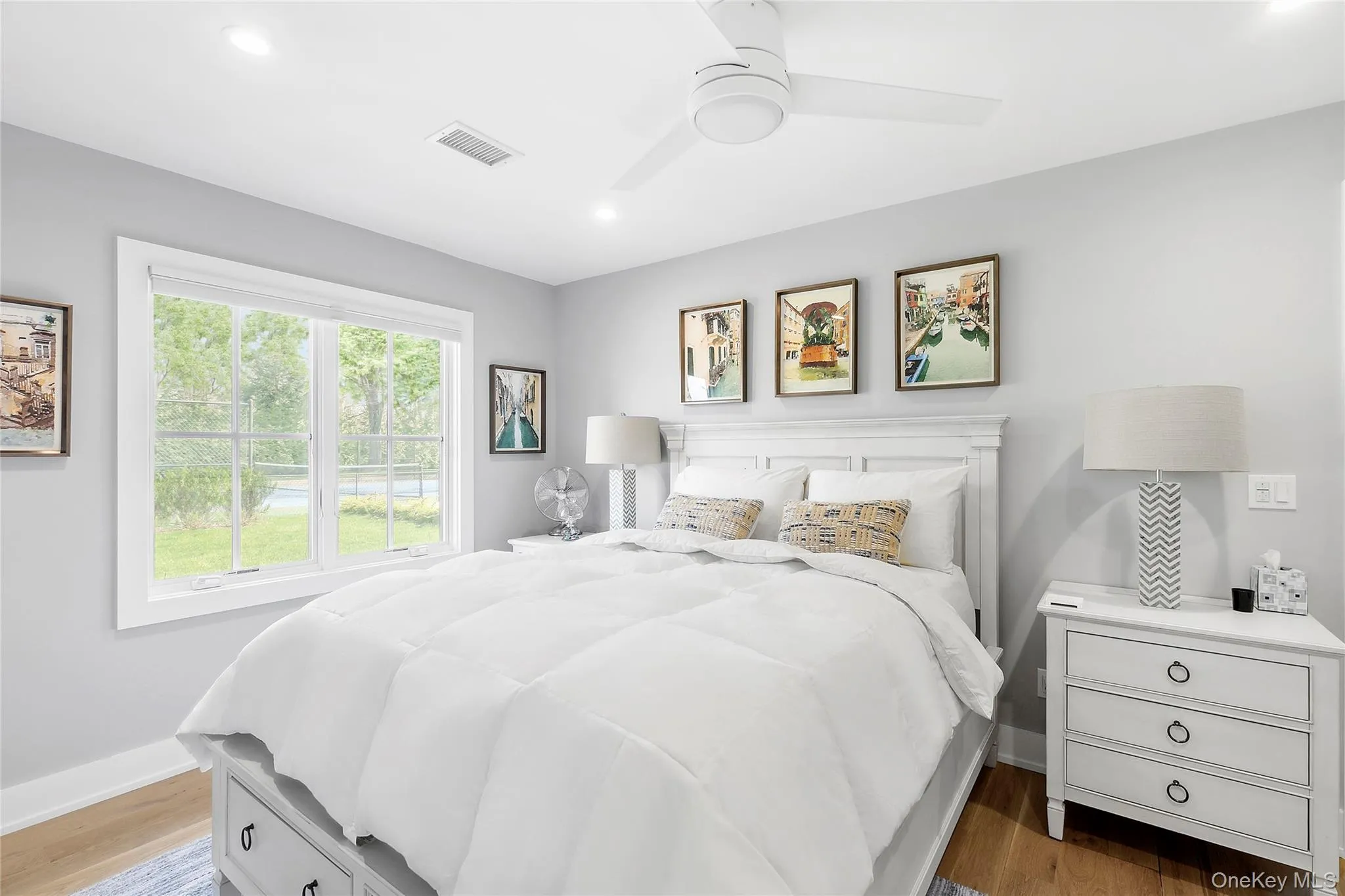 Bedroom featuring light wood-style flooring, recessed lighting, and ceiling fan Bedroom featuring light wood-style flooring, recessed lighting, and ceiling fan
