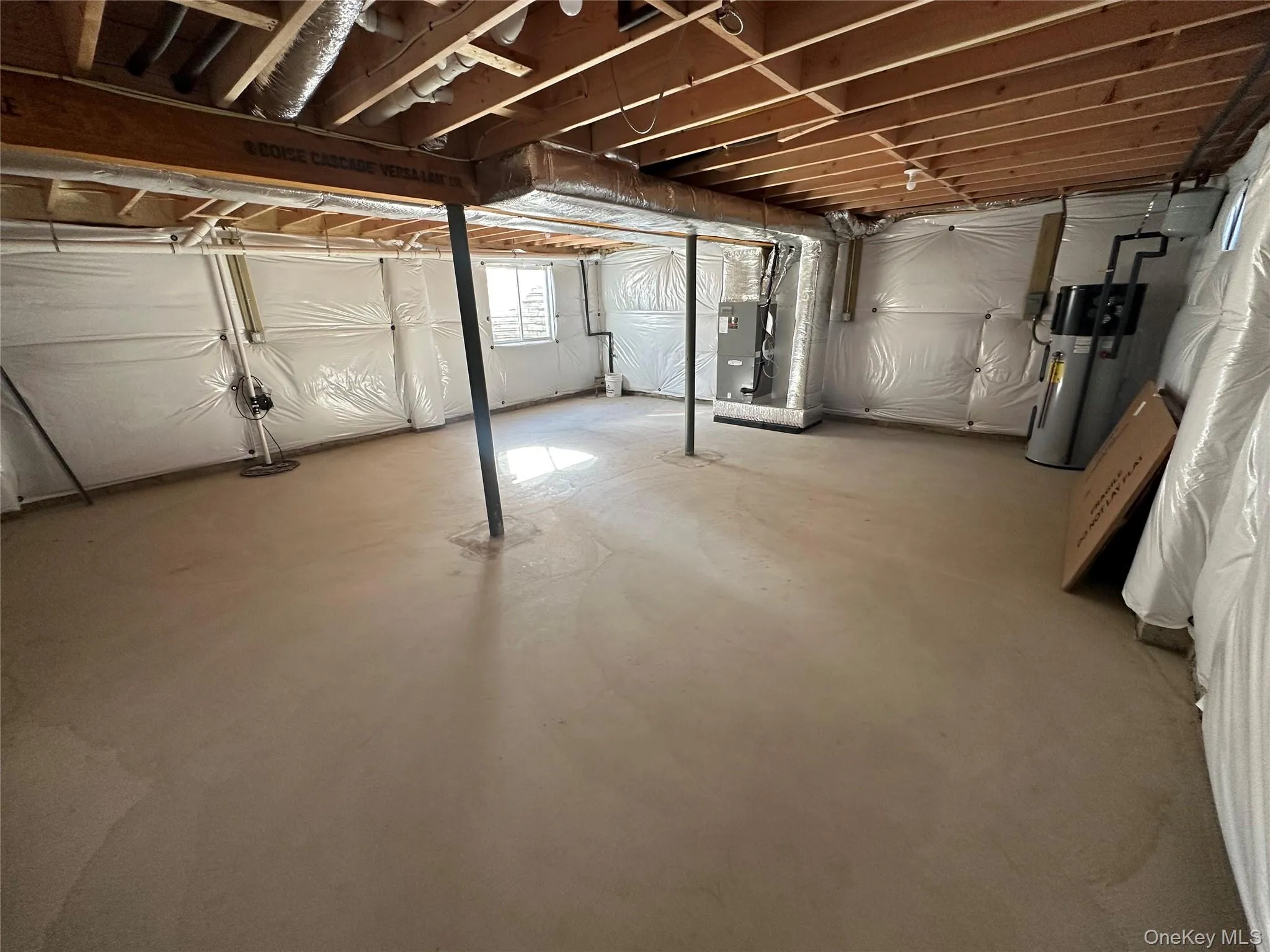 Basement with hybrid water heater and heating unit Basement with hybrid water heater and heating unit