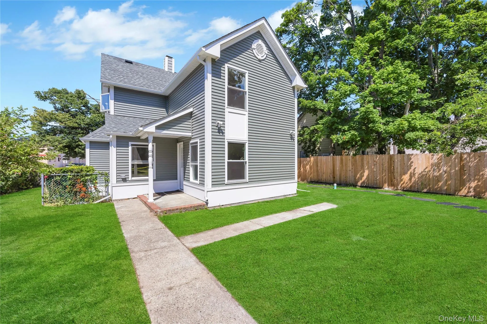 Traditional-style home featuring a shingled roof Traditional-style home featuring a shingled roof