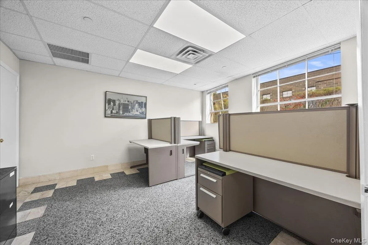 Unfurnished office featuring a paneled ceiling Unfurnished office featuring a paneled ceiling
