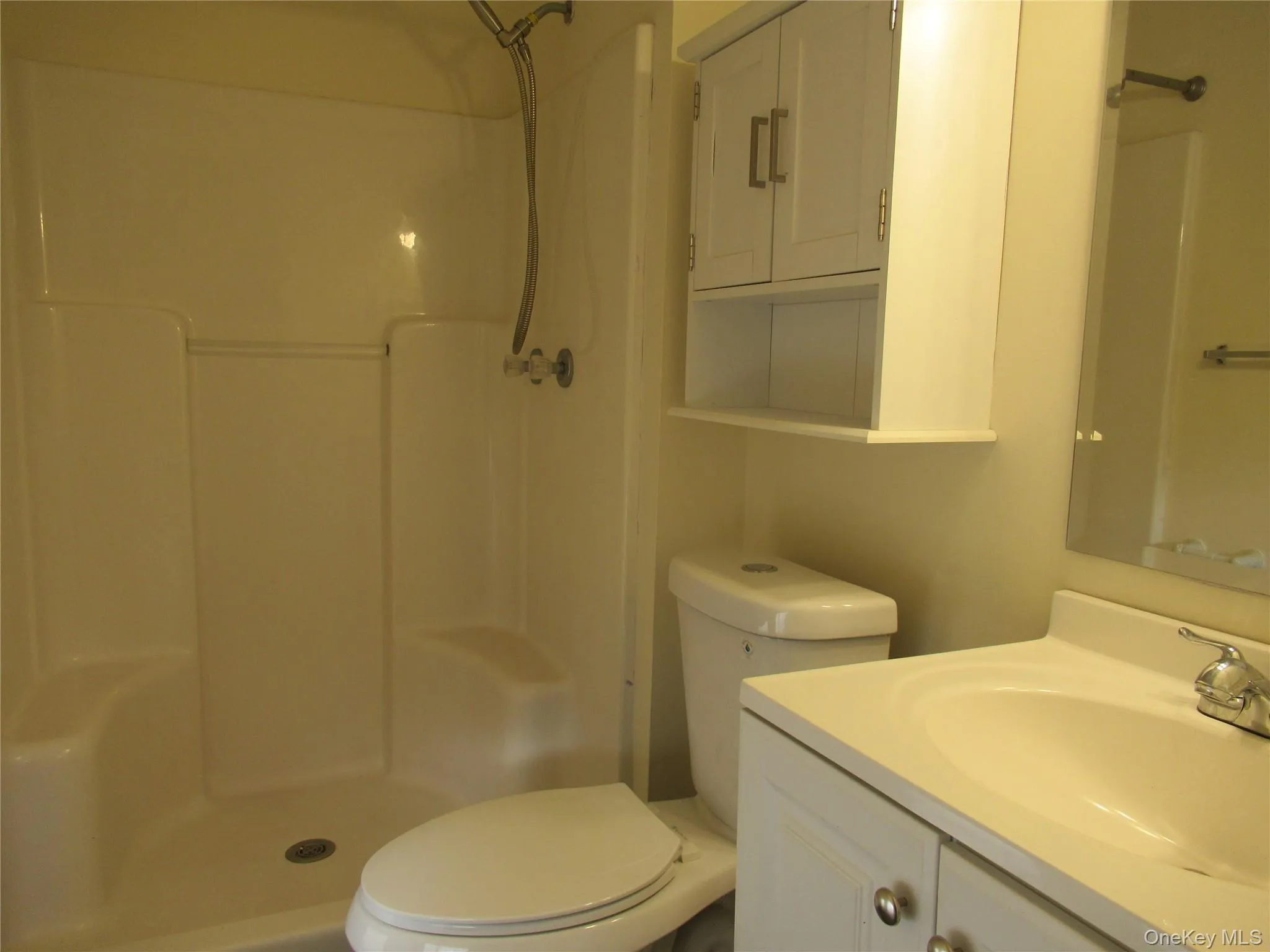 Full bath featuring a walk-in shower Full bath featuring a walk-in shower