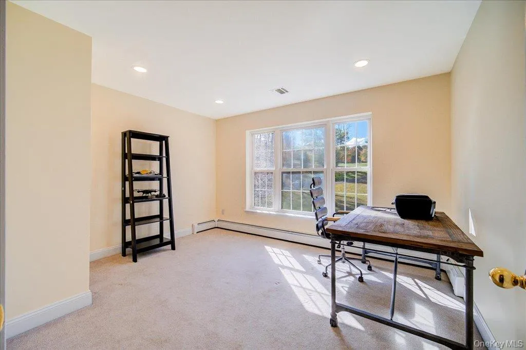 Office area featuring light carpet and recessed lighting Office area featuring light carpet and recessed lighting