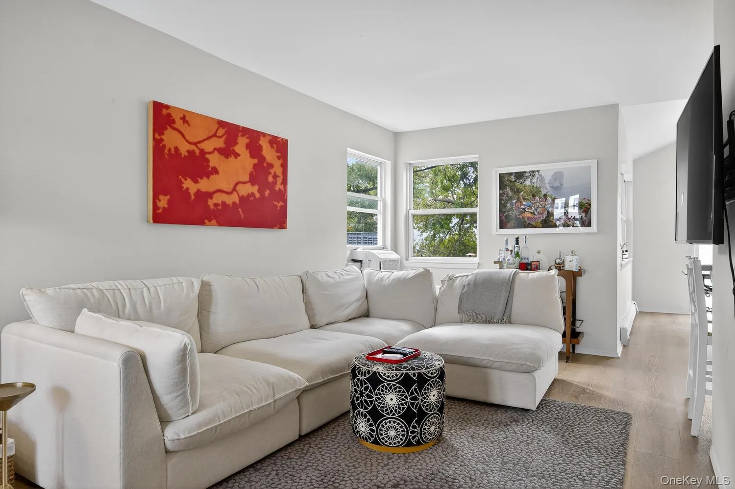 Living area with wood finished floors and baseboards Living area with wood finished floors and baseboards