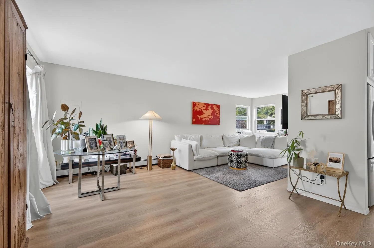 Living area with light wood-style flooring Living area with light wood-style flooring