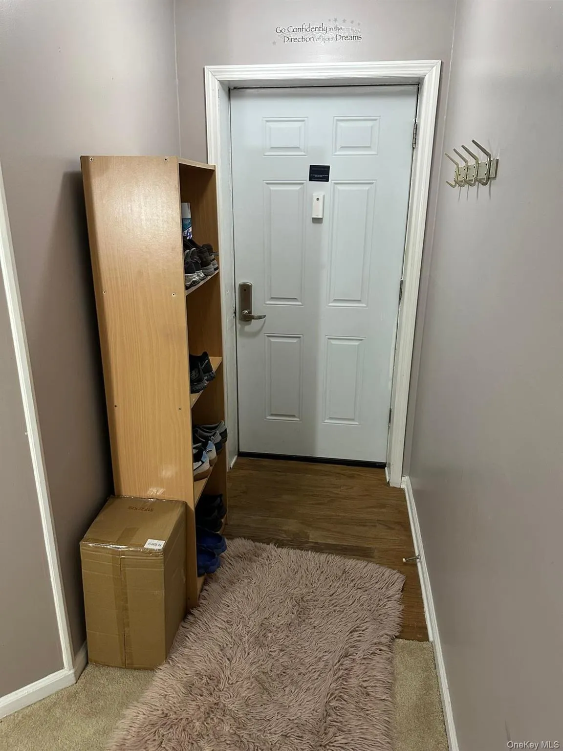 Mudroom featuring baseboards and dark wood finished floors Mudroom featuring baseboards and dark wood finished floors
