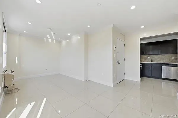 Spare room featuring recessed lighting and light tile patterned floors Spare room featuring recessed lighting and light tile patterned floors