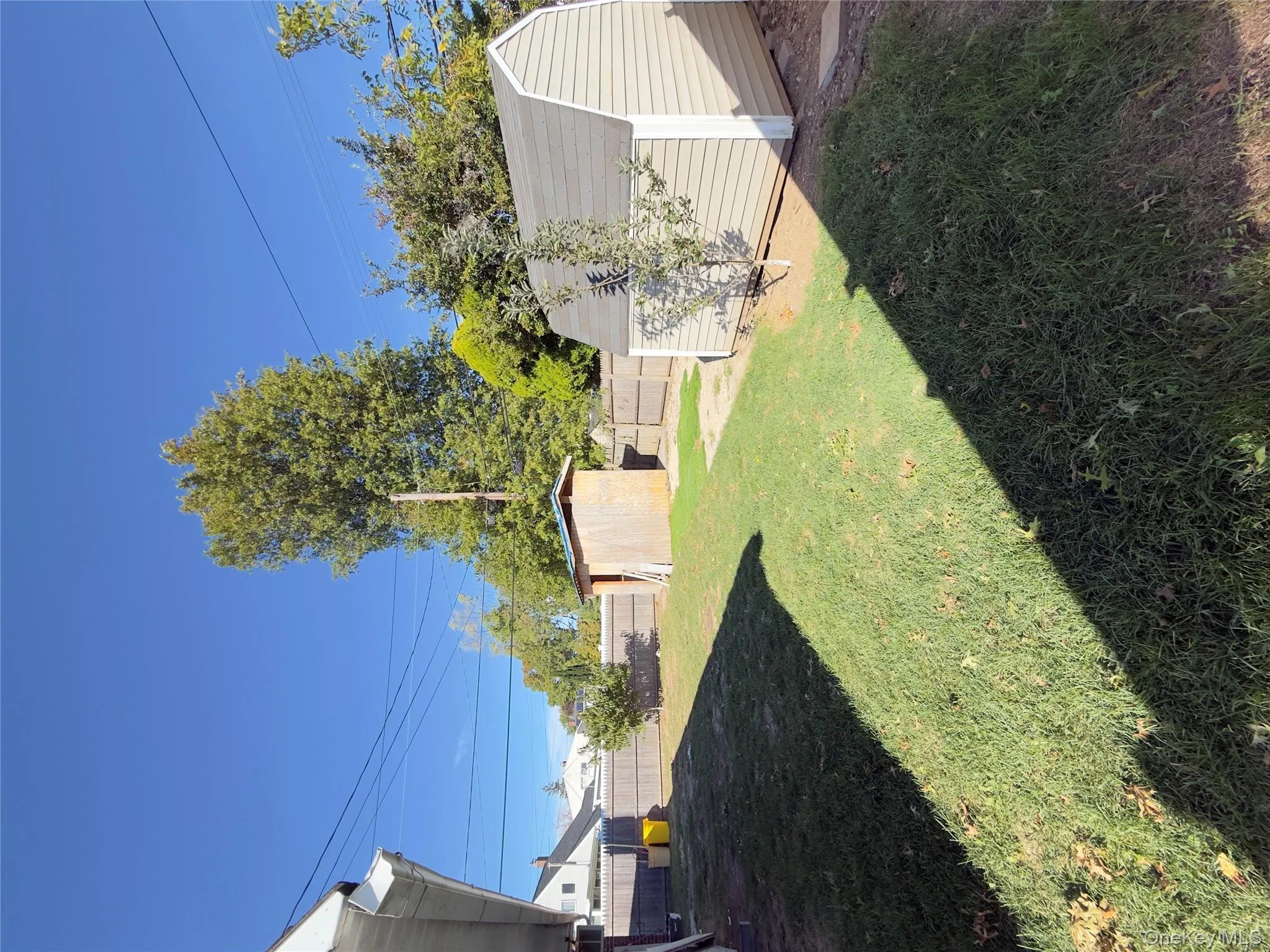 Fenced backyard with a storage unit Fenced backyard with a storage unit