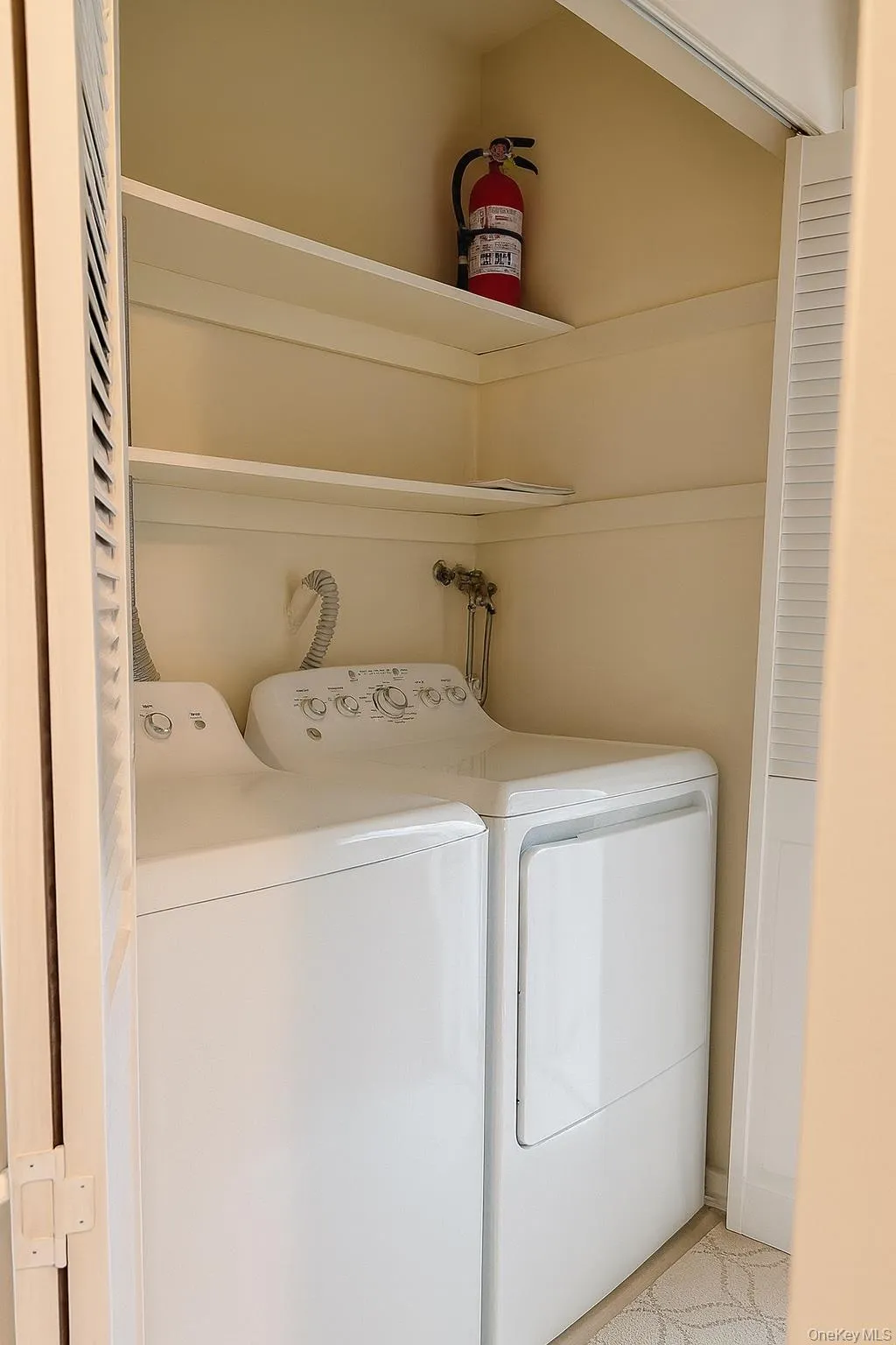 Laundry room featuring separate washer and dryer Laundry room featuring separate washer and dryer