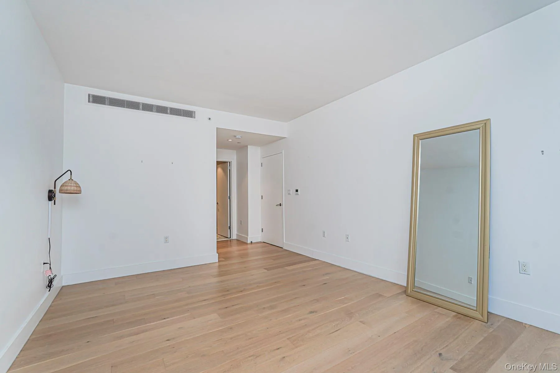Spare room featuring light wood-style flooring Spare room featuring light wood-style flooring