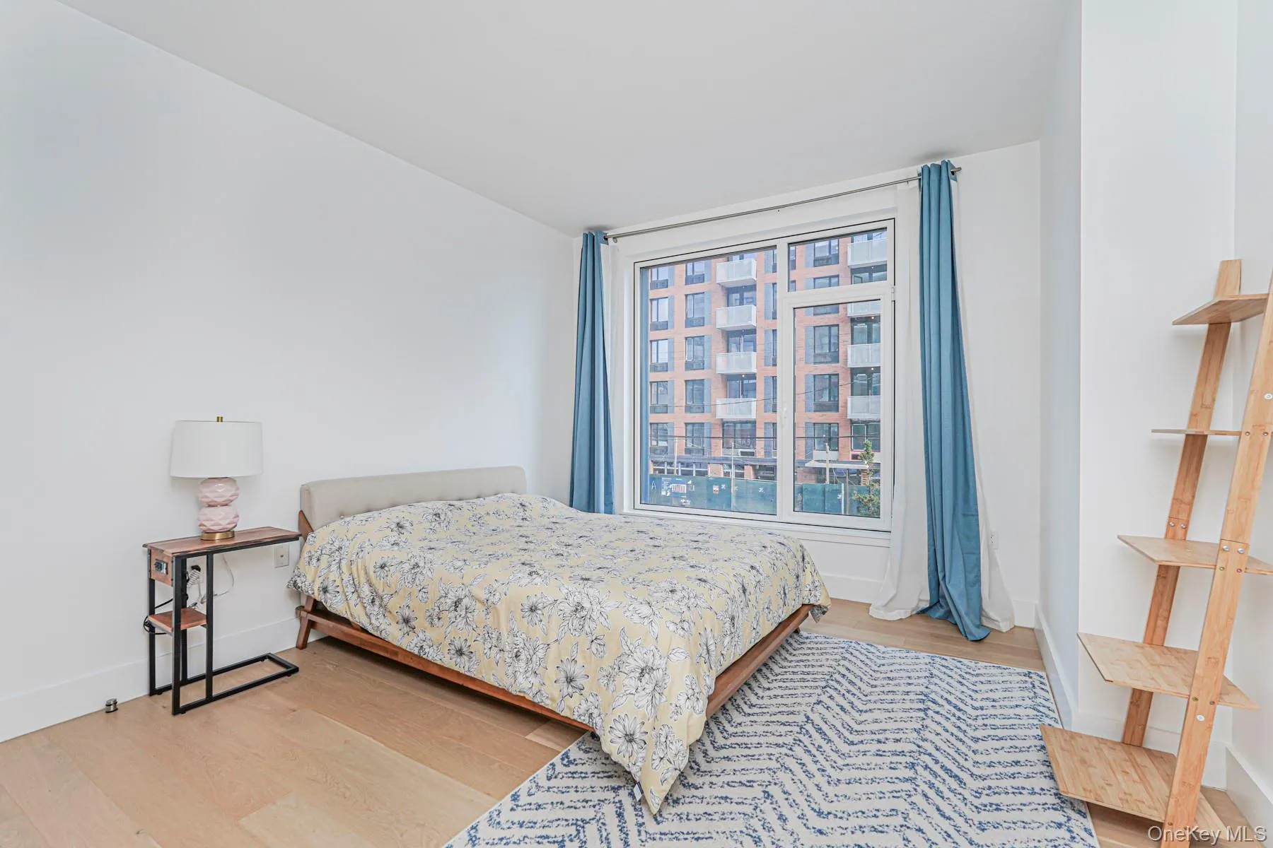 Bedroom with light wood-style flooring Bedroom with light wood-style flooring