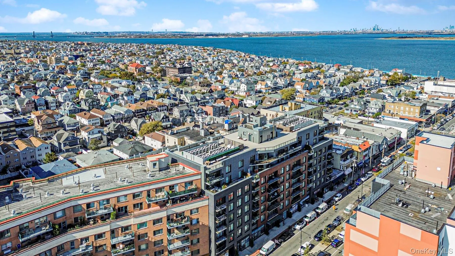 View of urban area with a large body of water View of urban area with a large body of water