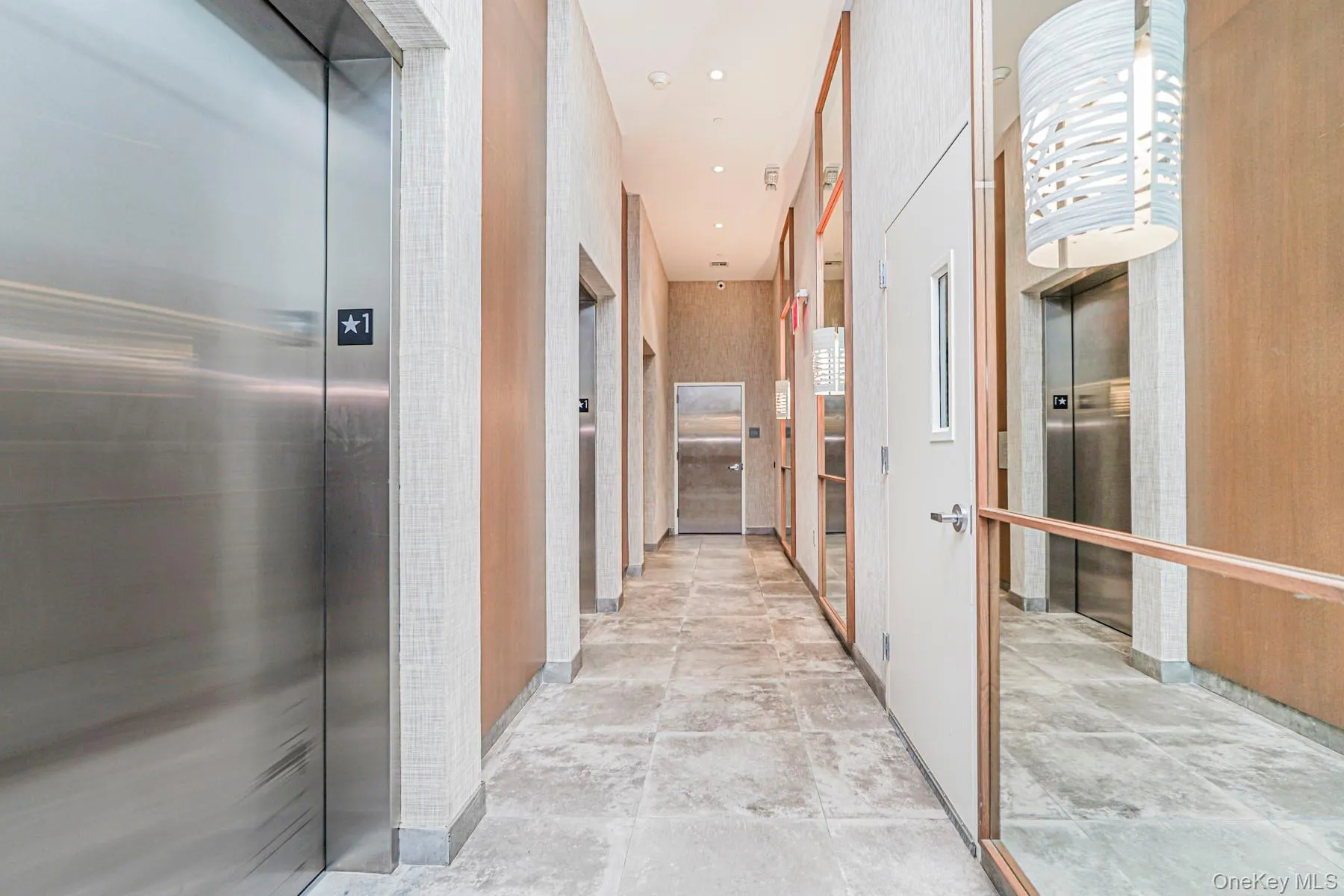 Corridor featuring elevator and recessed lighting Corridor featuring elevator and recessed lighting