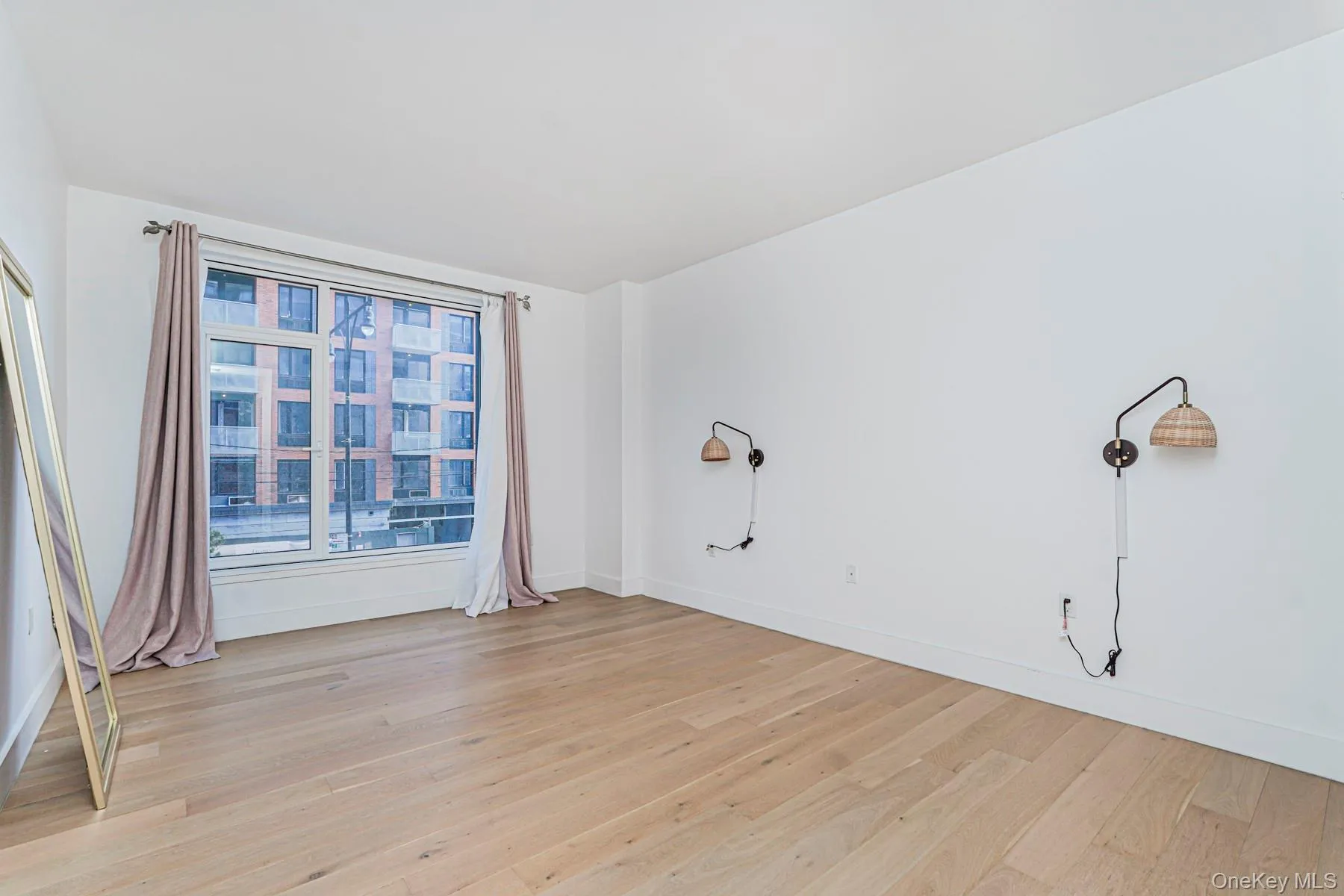 Unfurnished room with light wood finished floors Unfurnished room with light wood finished floors