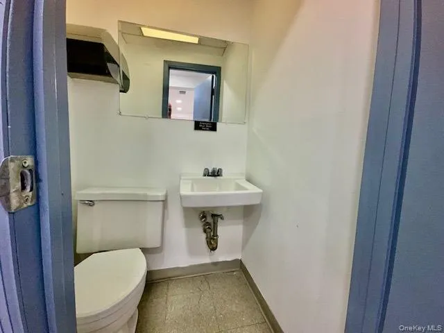 Bathroom with toilet and sink Bathroom with toilet and sink