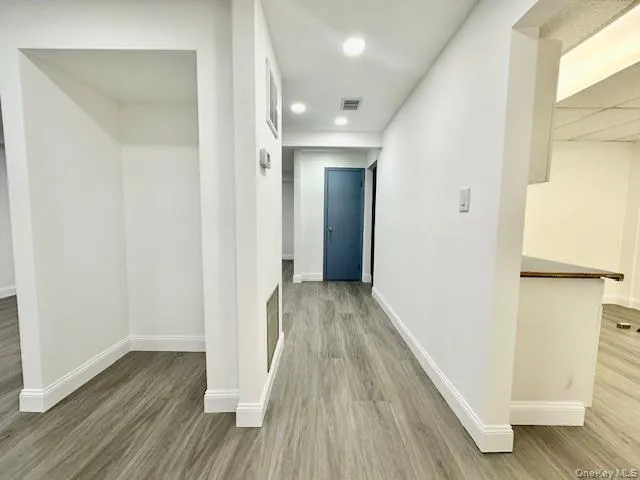 Hall with hardwood / wood-style flooring Hall with hardwood / wood-style flooring