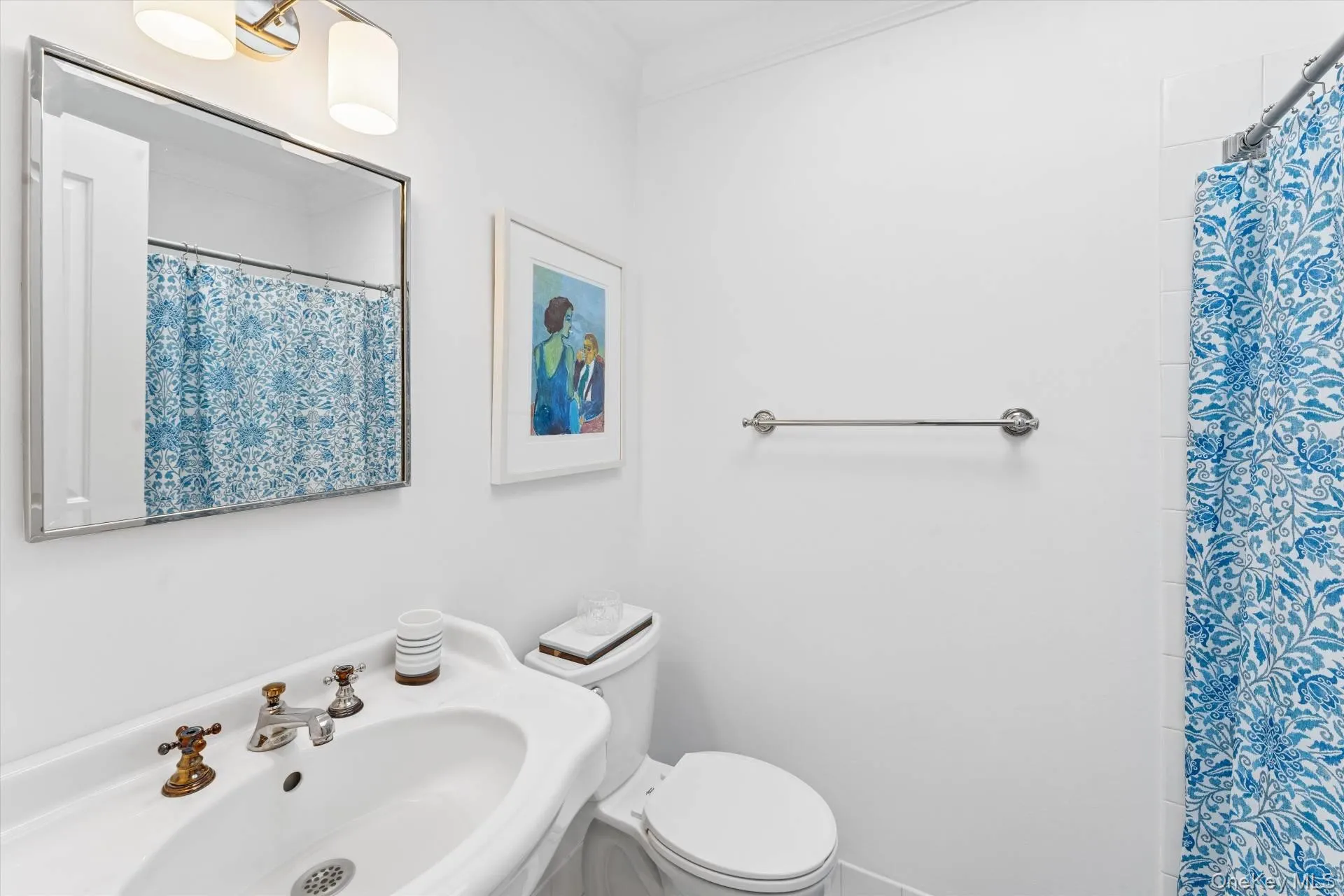 Full bath featuring a shower with curtain Full bath featuring a shower with curtain