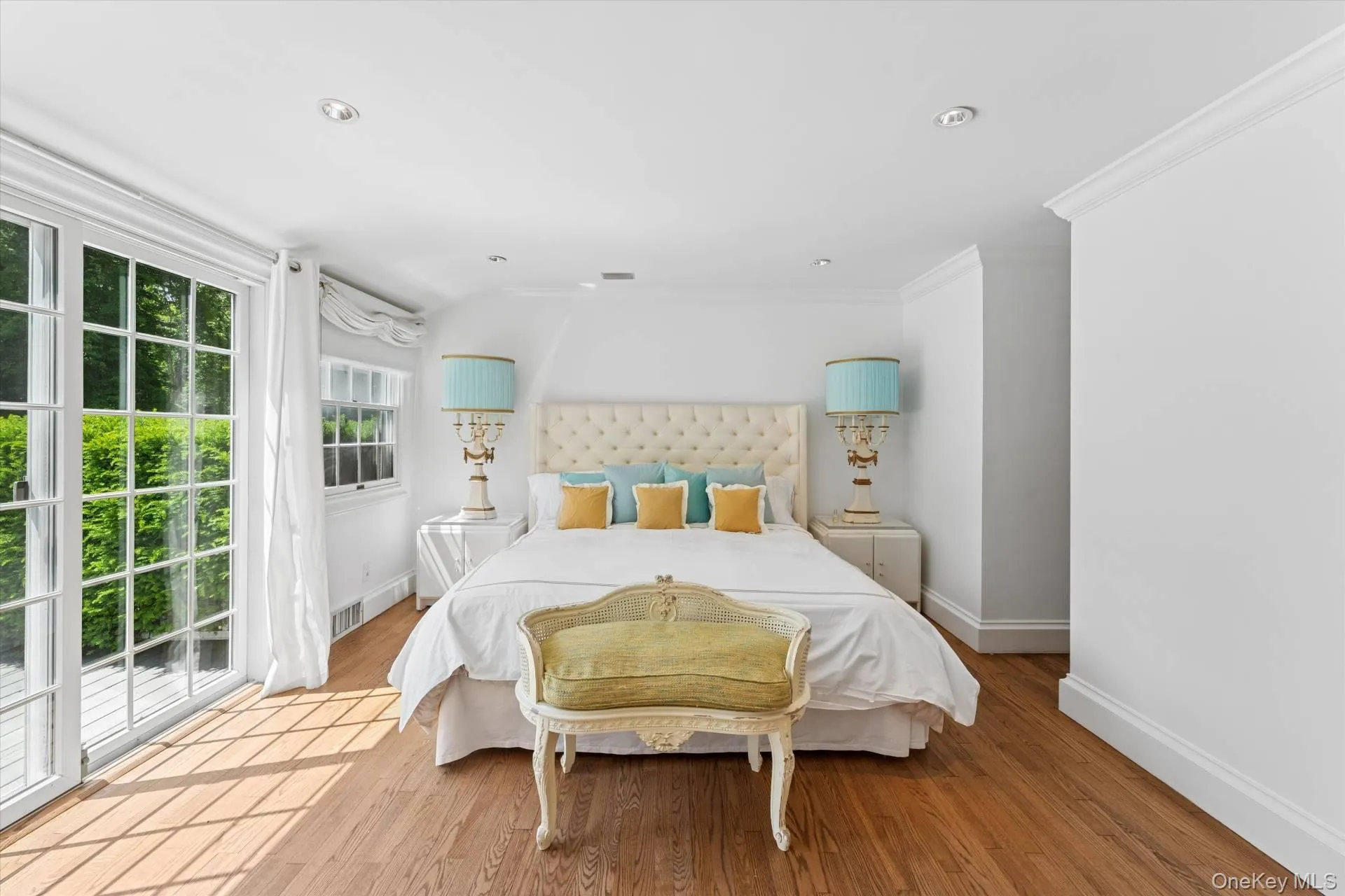 Bedroom with wood finished floors and recessed lighting Bedroom with wood finished floors and recessed lighting