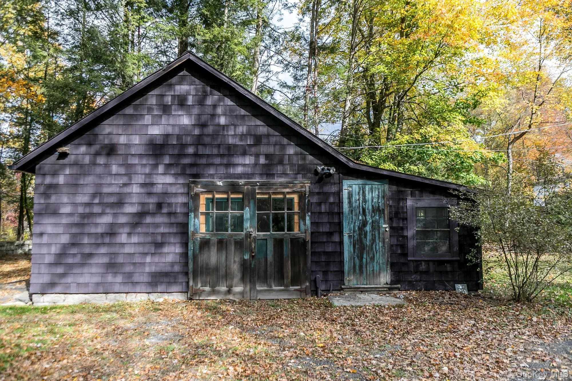 View of side of property featuring view of wooded area View of side of property featuring view of wooded area