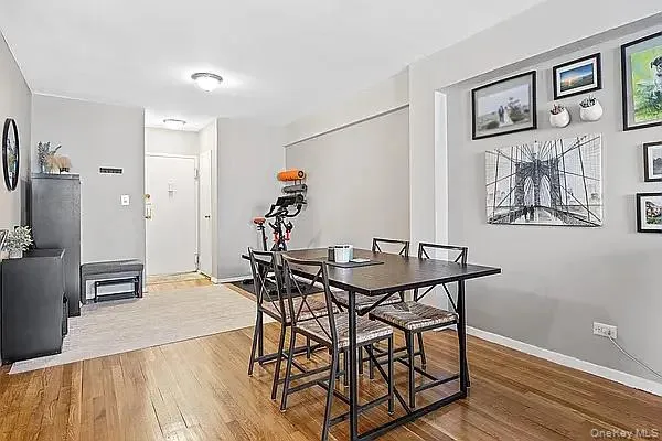 Dining space with light wood-type flooring Dining space with light wood-type flooring