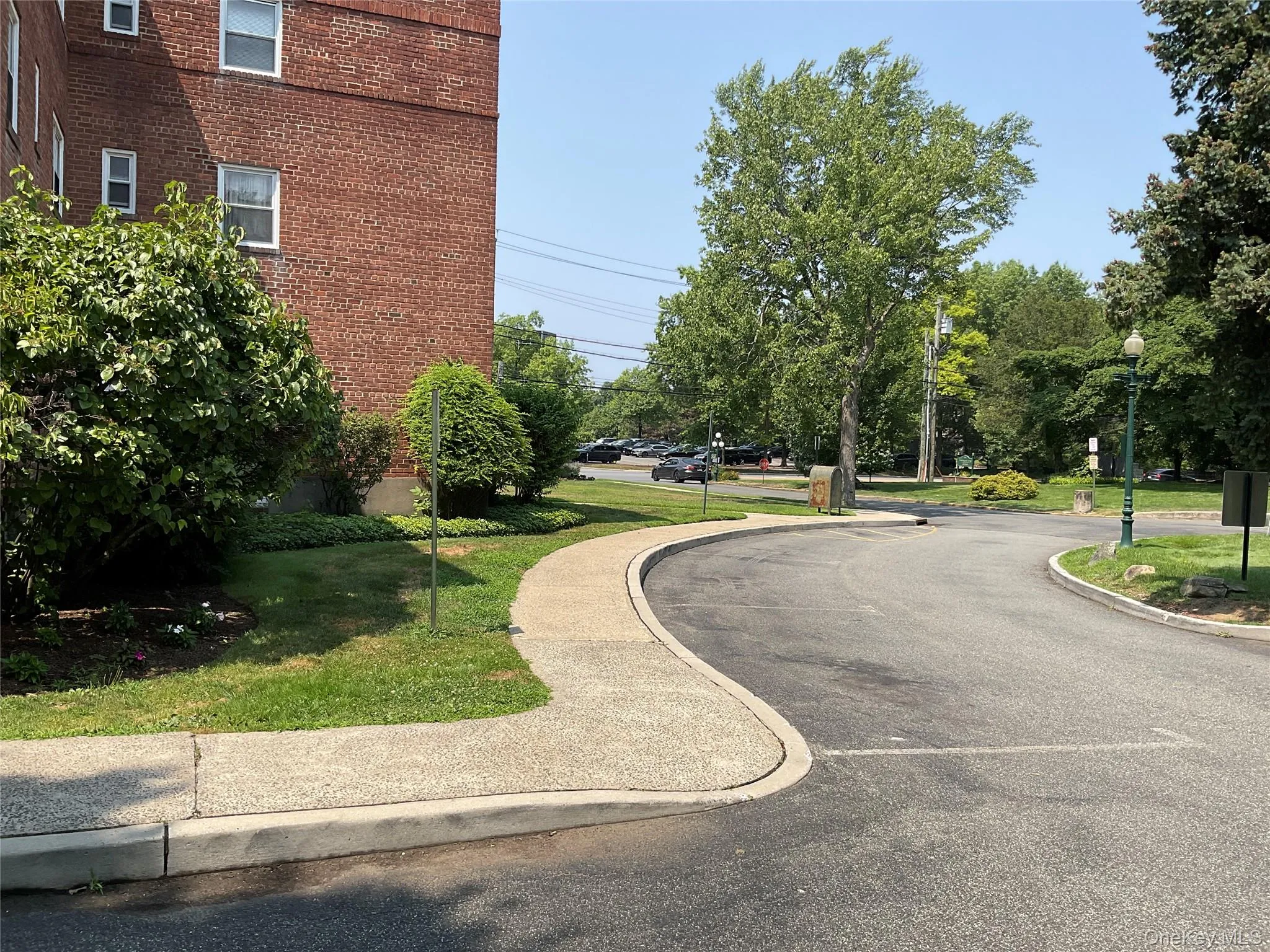 View of property's community featuring a yard View of property's community featuring a yard